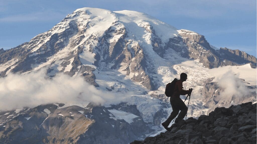Man climbing a mountain representing saturn lines