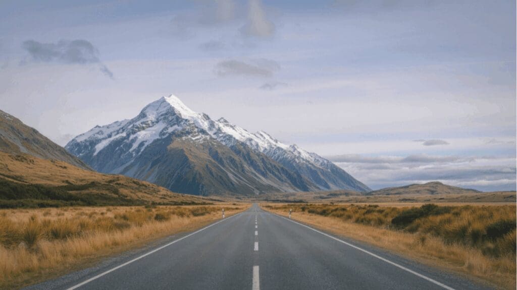 long road with mountin view representing saturn and one's slow journey